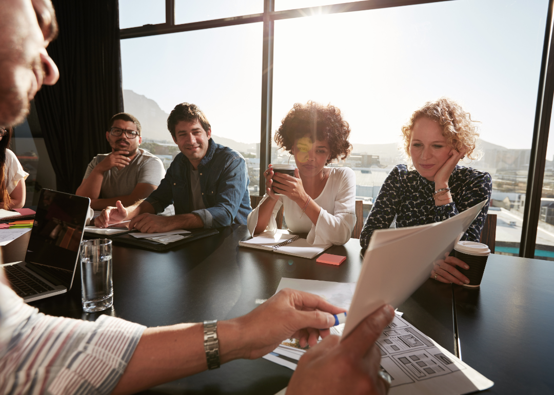 A group of corporate professionals in a conference room.