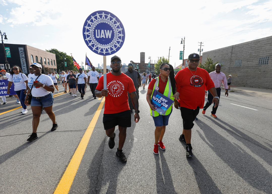 United Auto Workers members march in the Detroit Labor Day Parade on September 4, 2023 in Detroit, Michigan.