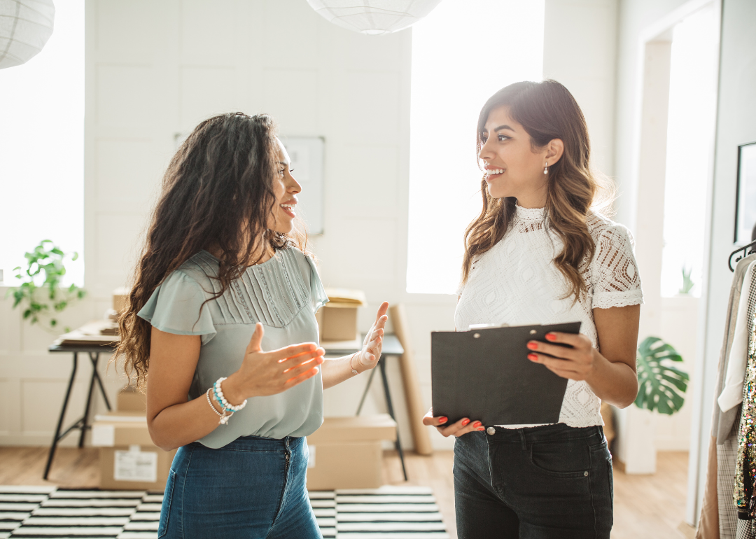 Two women small business owners talking