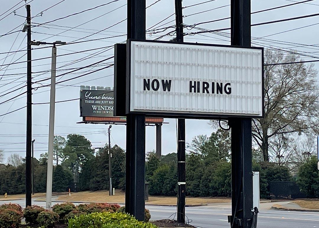 roadside "now hiring" sign