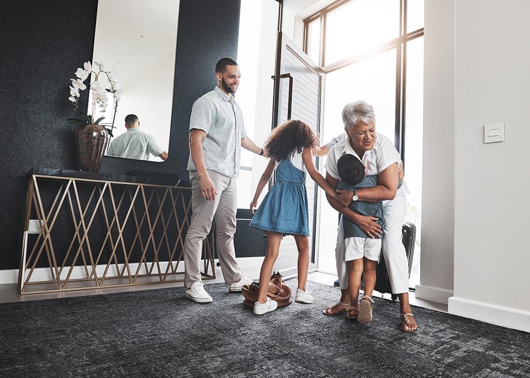 grandparent visiting children and grandchildren in nice home