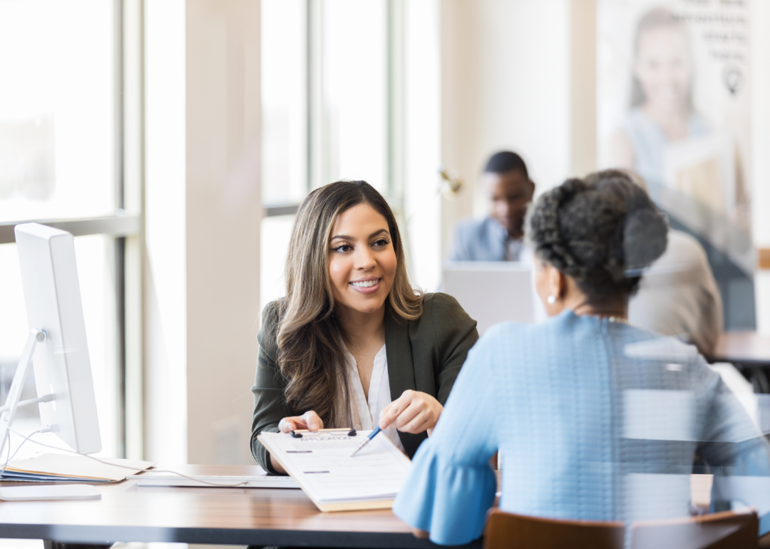 loan officer going over paperwork with client