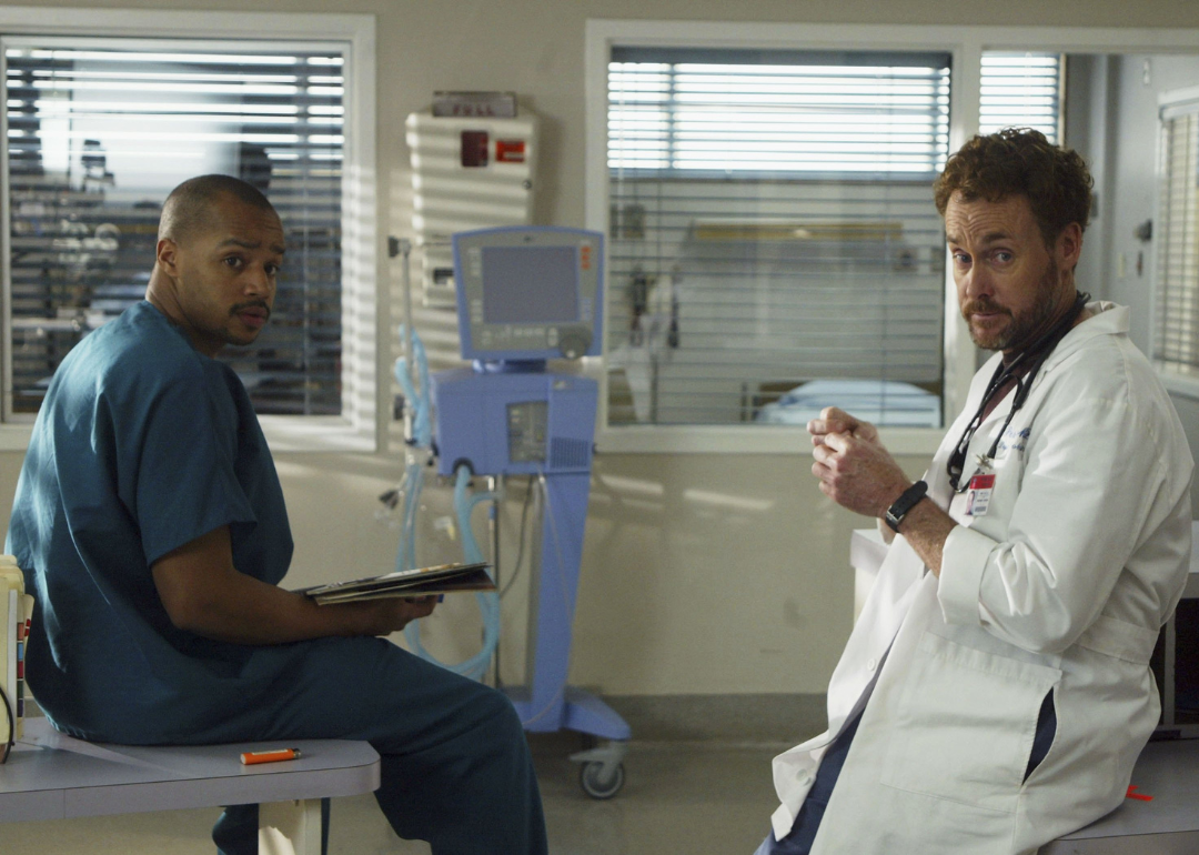 Actors Donald Faison and John C. McGinley work on the set of "Scrubs" at the old North Hollywood Medical Centerl on January 17, 2006 in North Hollywood, California. 