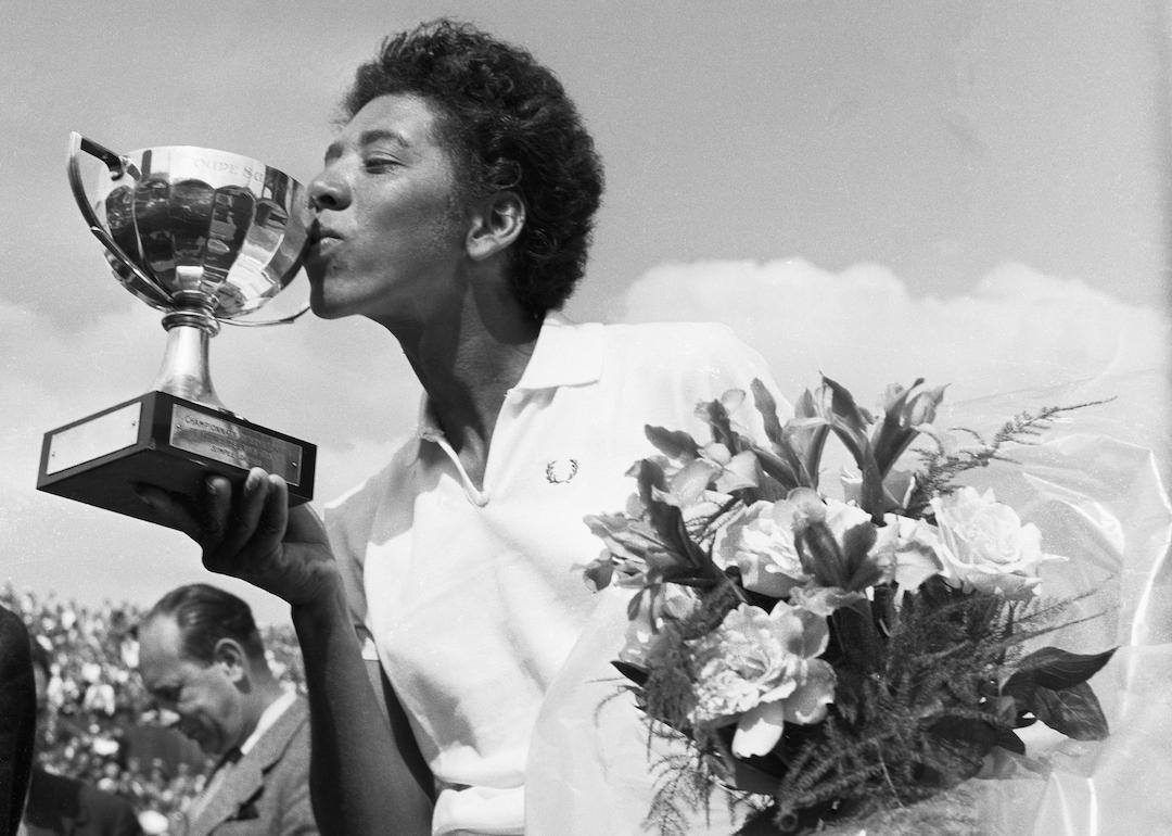 Althea Gibson kisses the cup she was awardedafter winning the French International Tennis Championships in Paris in 1956.