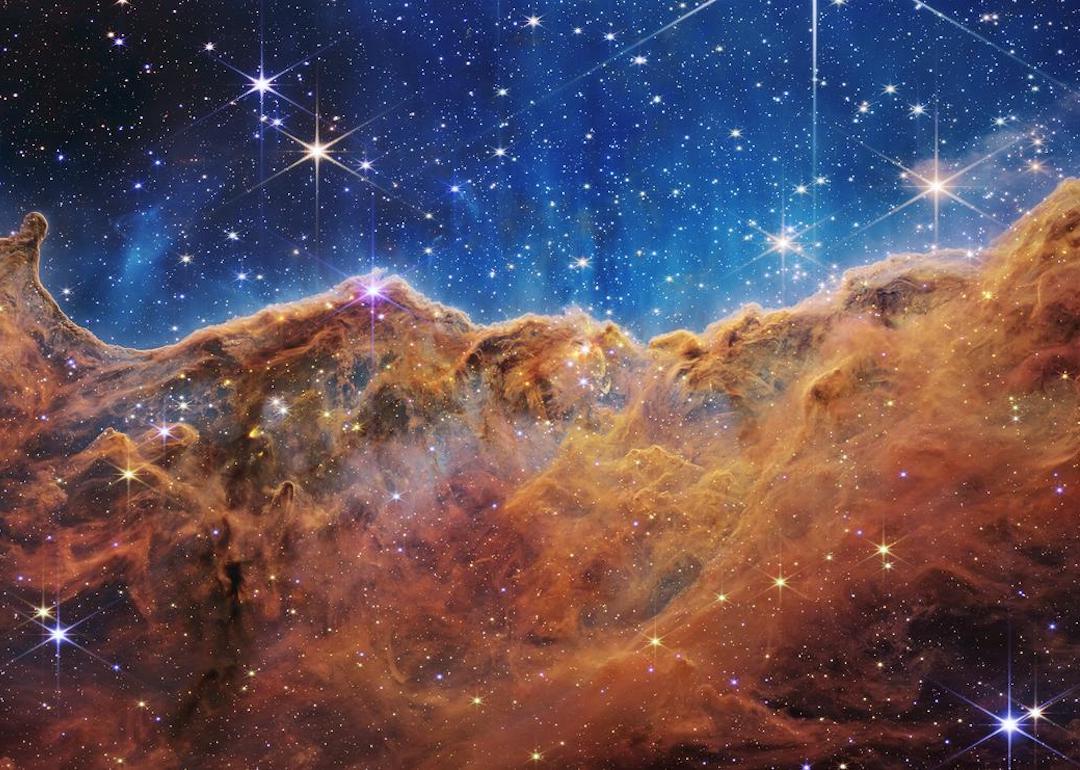 James Webb Space Telescope NIRCam Image of the 'Cosmic cliffs' in Carina Nebula via NASA.