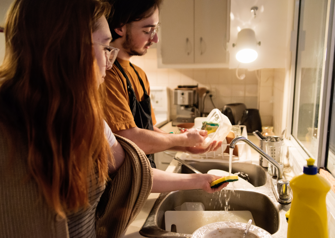 two people doing dishes together