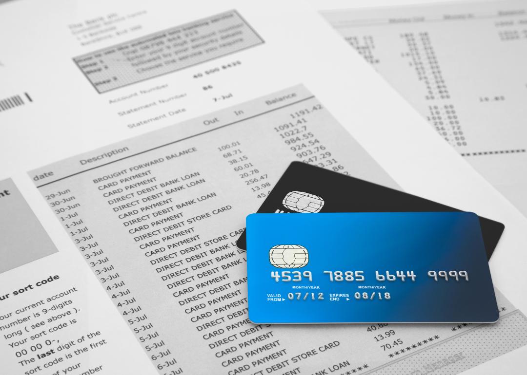 bank cards with bank statements in background