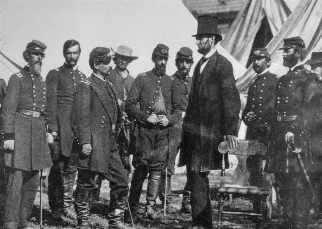 President Abraham Lincoln with General George B. McClellan at his headquarters at Antietam, October 3, 1862. From left: General George W. Morell, Colonel Alexander S. Webb, General McClellan, scout Adams, Dr. Jonathan Letterman, unidentified officer, President Lincoln, Colonel Henry Hunt, General Fitz, John Porter, unidentified officer.