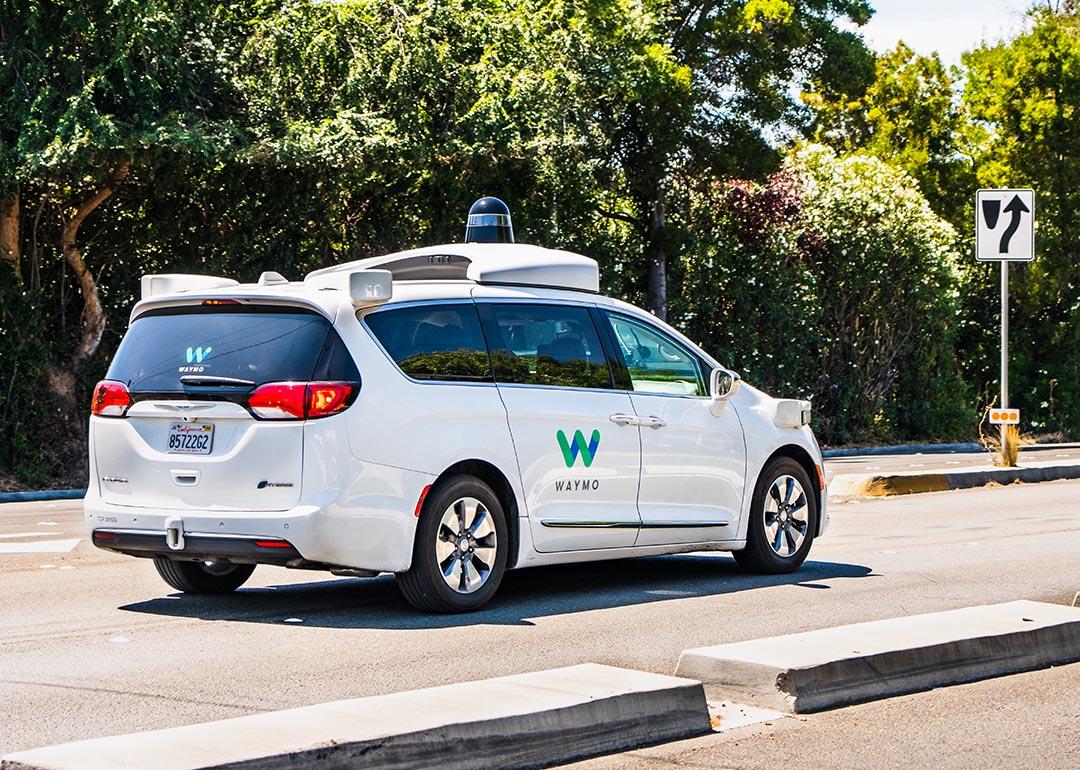 Waymo self driving car performing tests on a street 