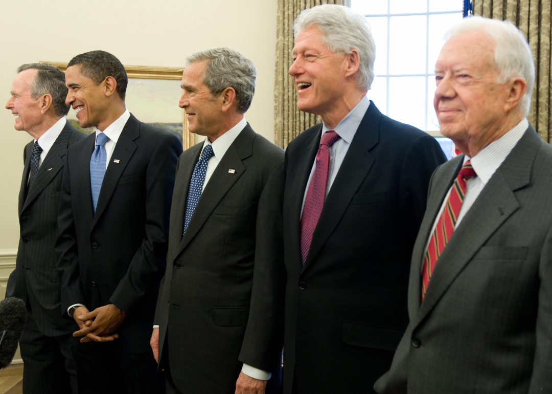 Former US Presidents George W. Bush (C), Barack Obama (2nd L), George H.W. Bush (L), Bill Clinton (2nd R) and Jimmy Carter (R) in the Oval Office of the White House in Washington, DC, on January 7, 2009.