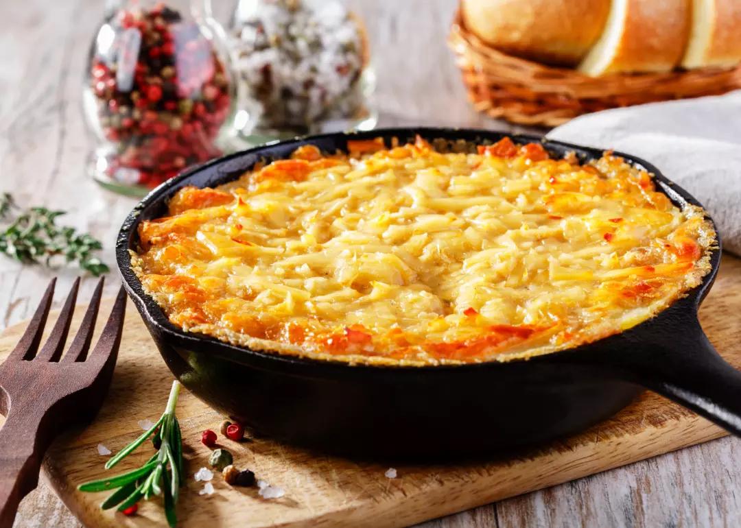 Potato side dish in a skillet.
