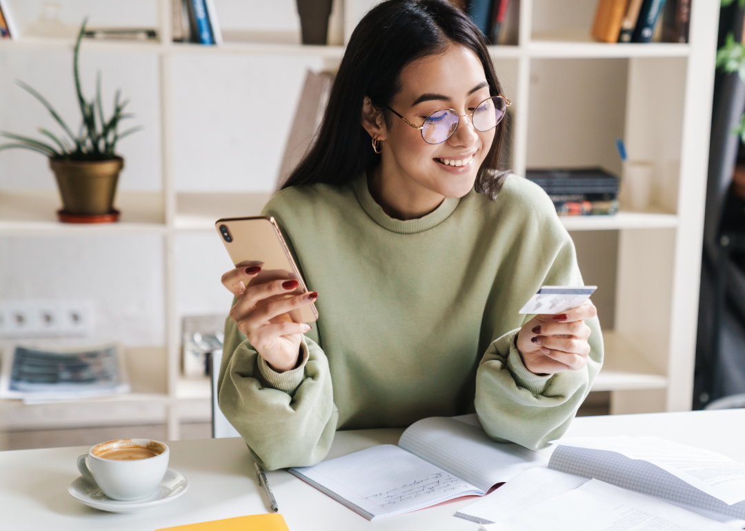 Young woman with credit card.