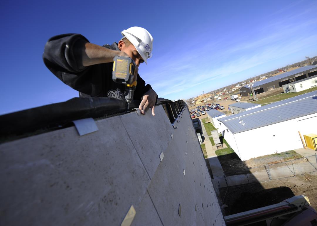 Construction workers building an eco-friendly school