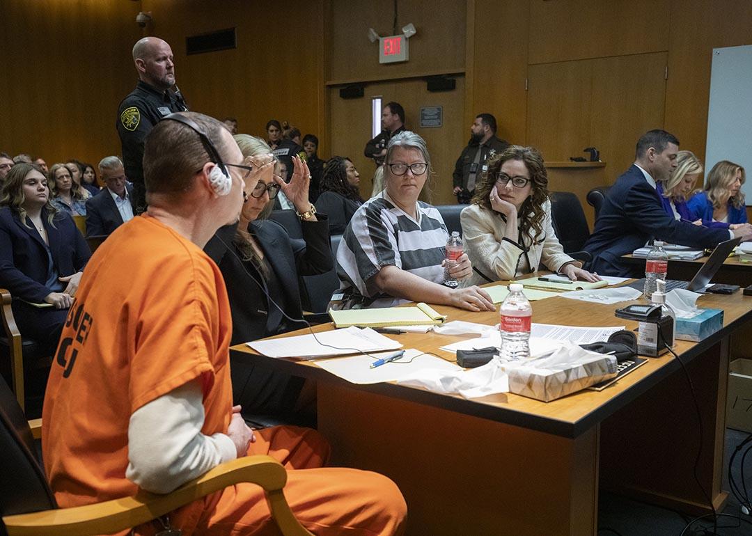 James Crumbley, Jennifer Crumbley, and attorneys sit in court for sentencing on four counts of involuntary manslaughter for the deaths of four Oxford High School students who were shot and killed by the Crumbley parents' son.