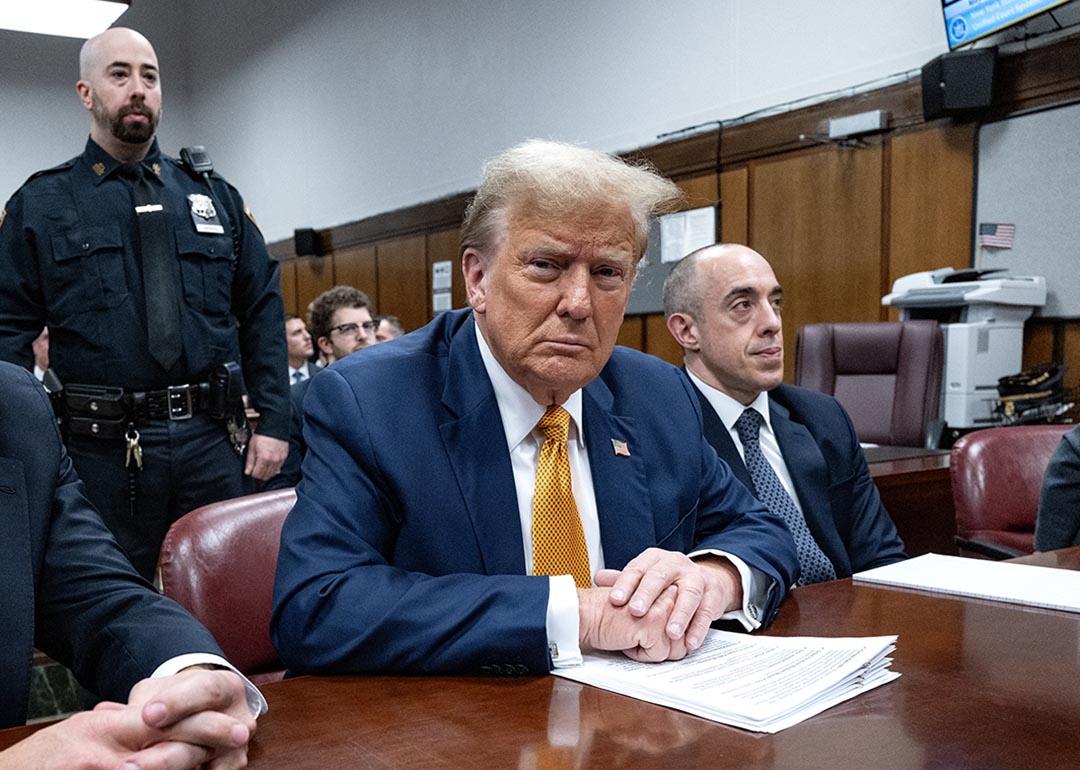 Former US President Donald Trump, center, attends his trial for allegedly covering up hush money payments linked to extramarital affairs, at Manhattan Criminal Court in New York City, on May 14, 2024.