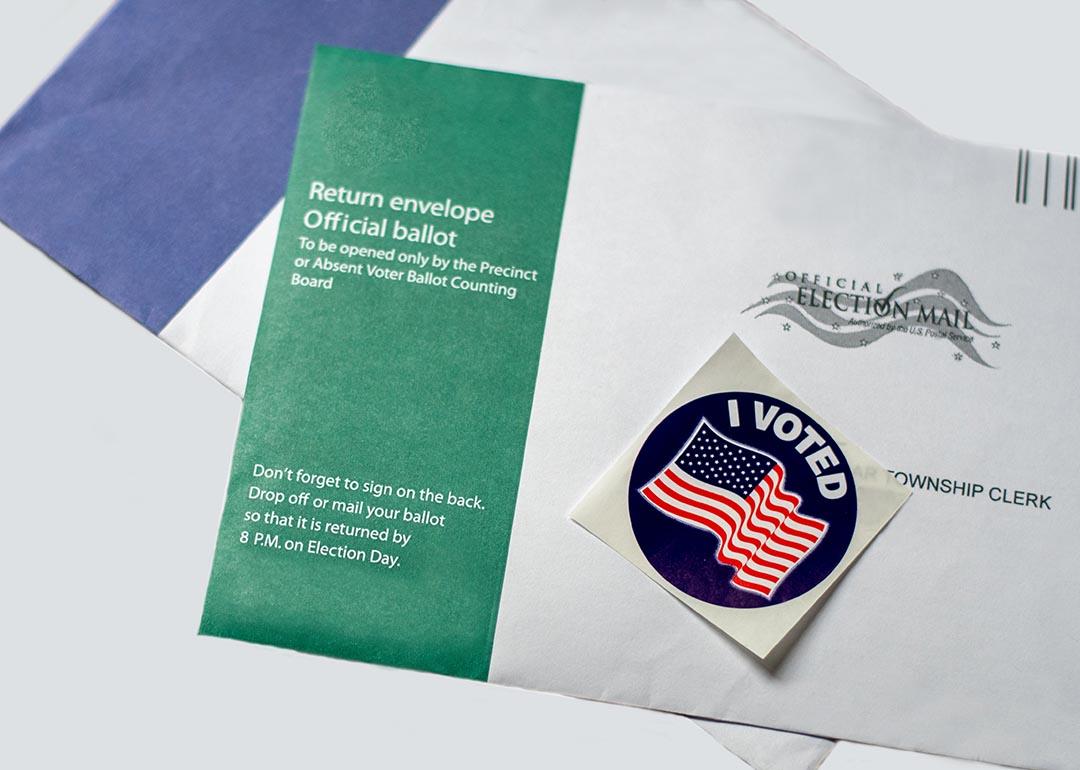Official U.S. ballot return envelopes and "I voted" sticker for U.S. election.