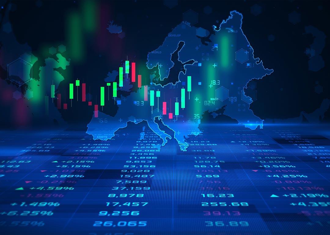 Concept of futures trading and European stock market illustrated by candlestick charts superimposed on a map of Europe.