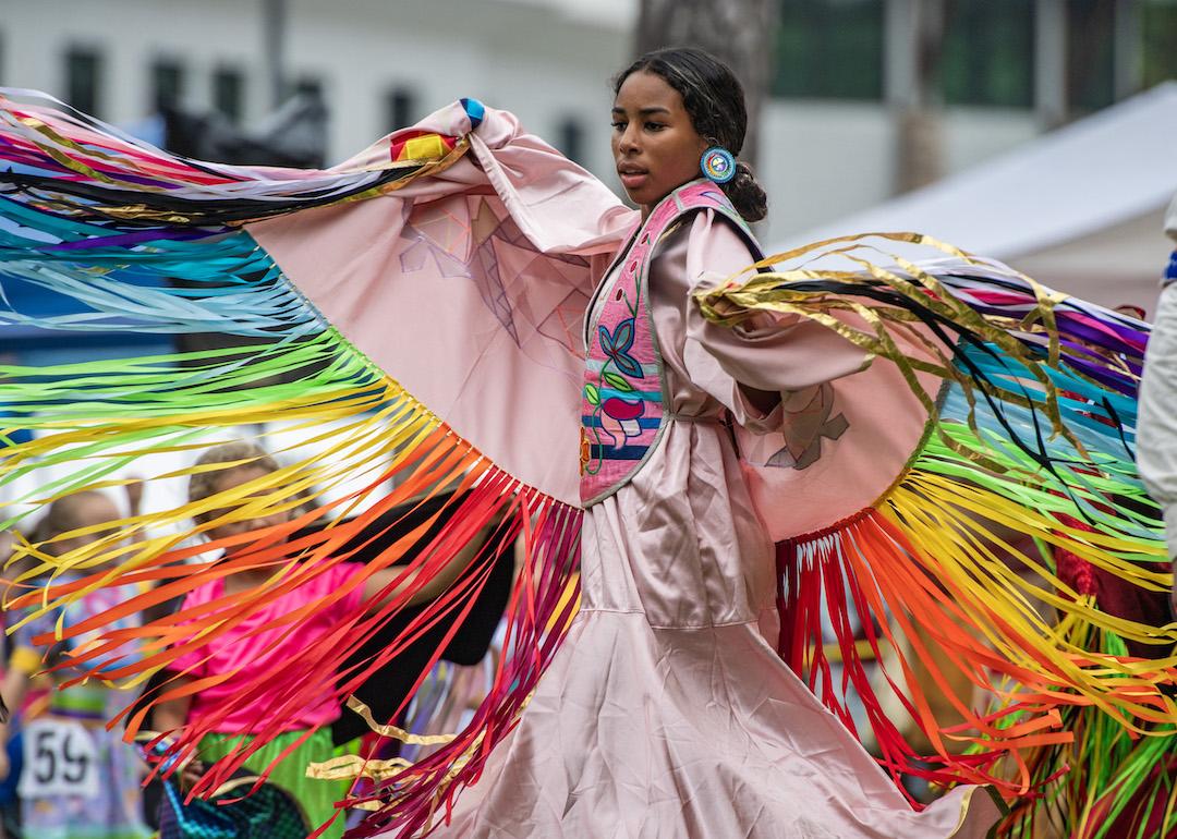 Indigenous person dances during the inter tribal dance at the 103rd Annual Mashpee Wampanoag Pow Wow in Mashpee, Massachusetts on July 5, 2024.