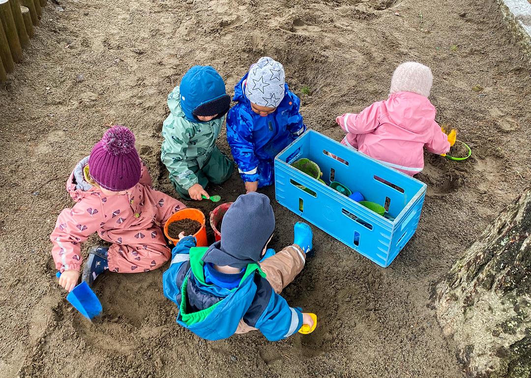 Children playing outside at a child care program run by the Norwegian nonprofit Kanvas.