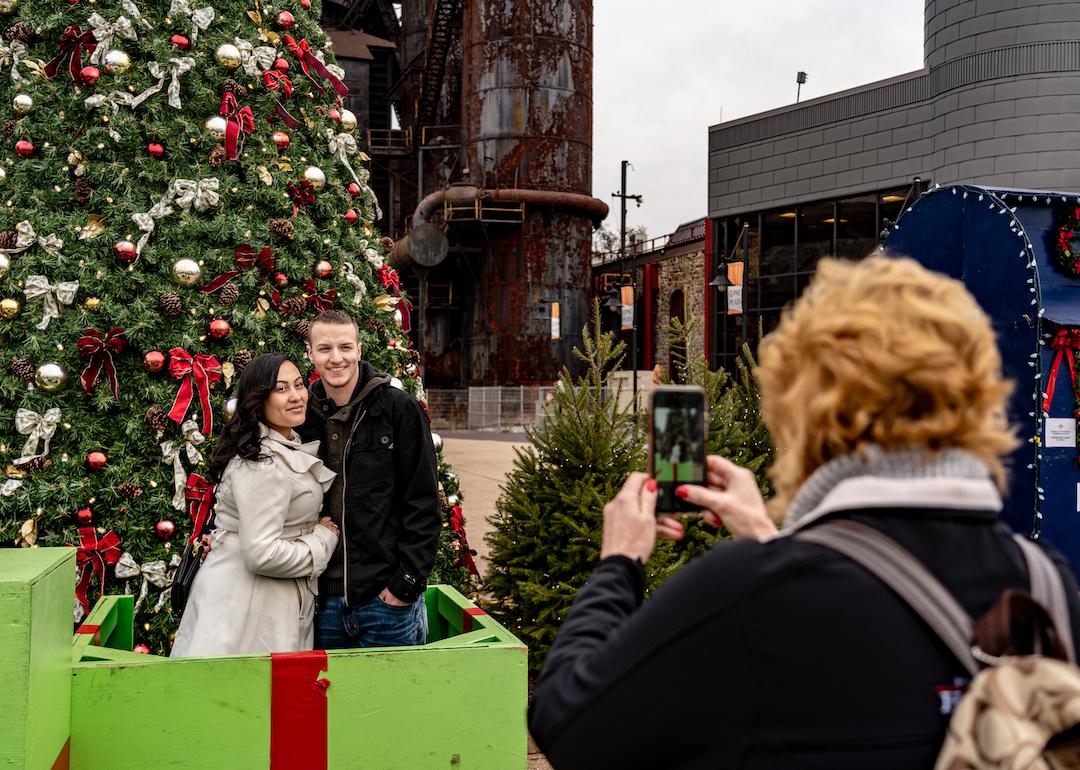 Visitors pose for a photo at the Christkindlmarket in Bethlehem, Pennsylvania.