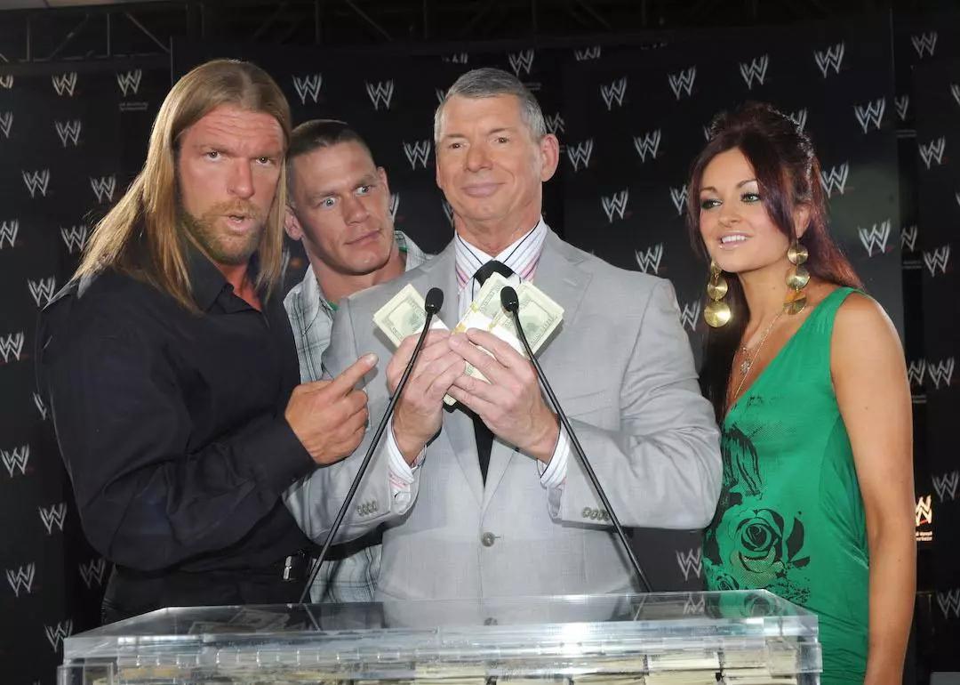Wrestlers Triple H and John Cena, WWE Chairman Vince McMahon, and WWE Diva Maria.