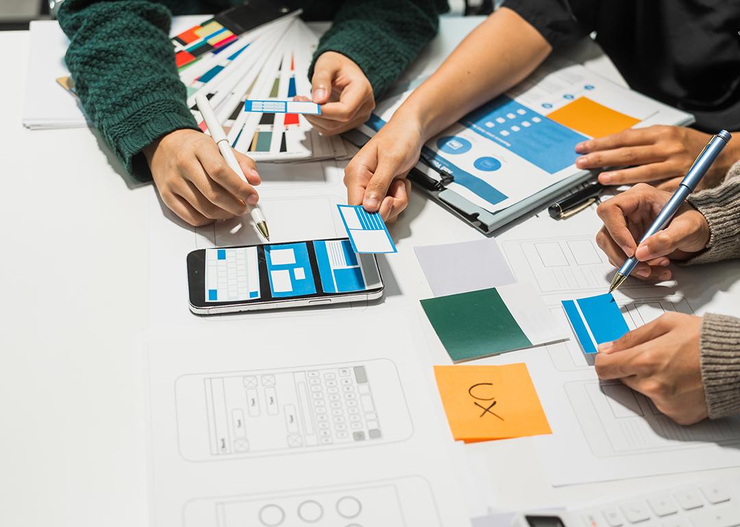A creative team collaborating on UX product development.