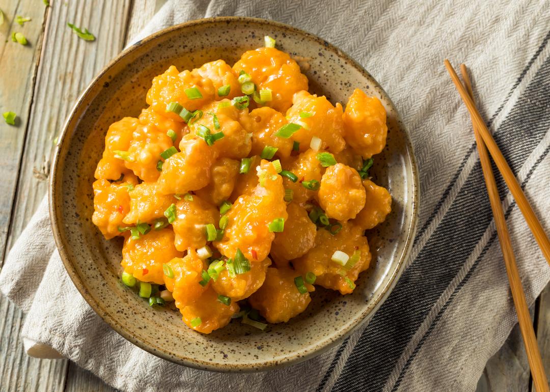 Homemade Asian bang bang shrimp with green onions.