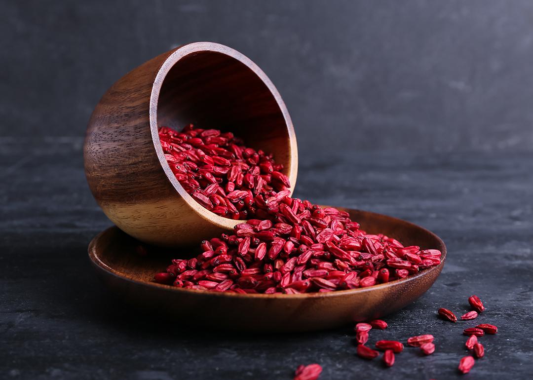 A bowl and plate with dried barberries.