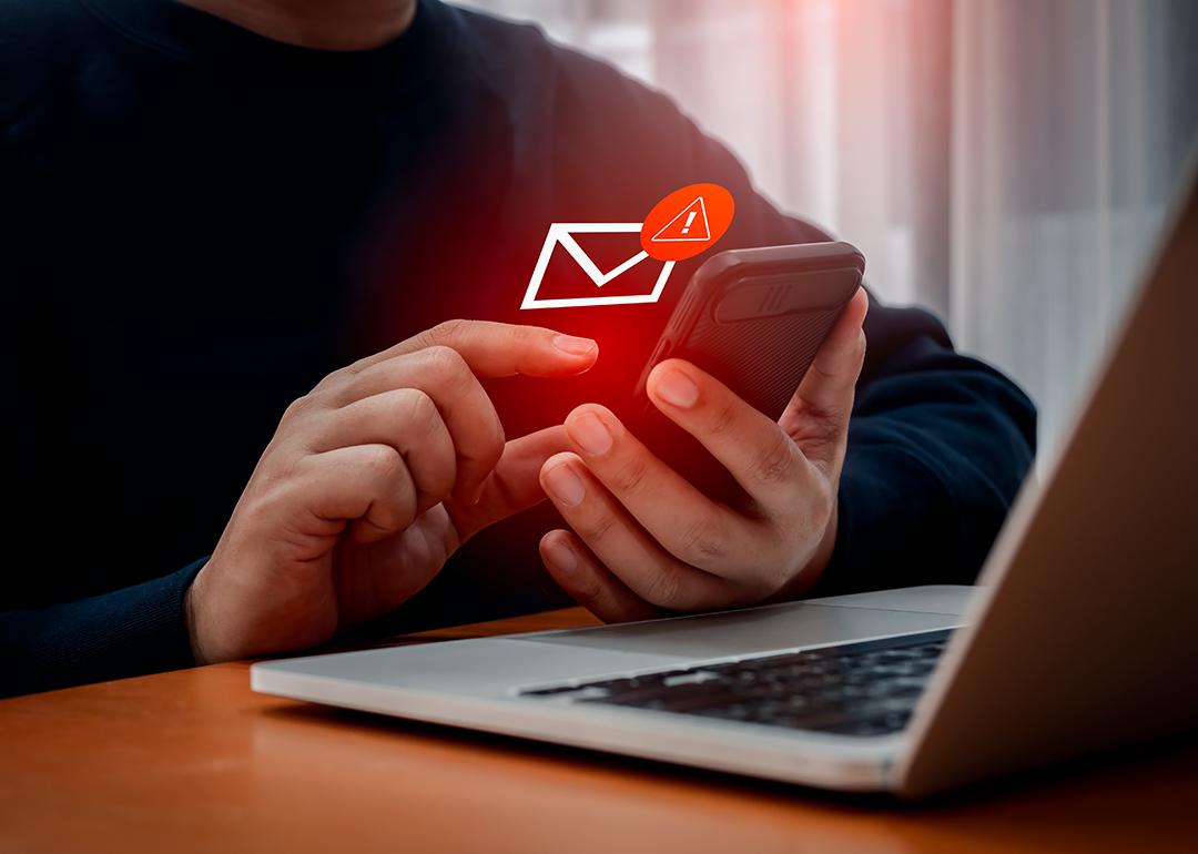 Person receiving a fraudulent text message.