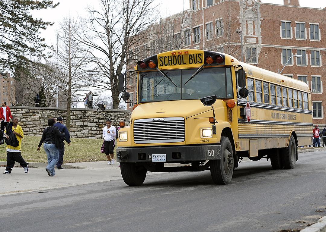 Students around a school bus in Kansas City, Missouri.