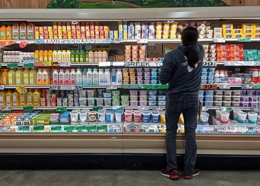 Trader Joe's market dairy aisle being restocked.