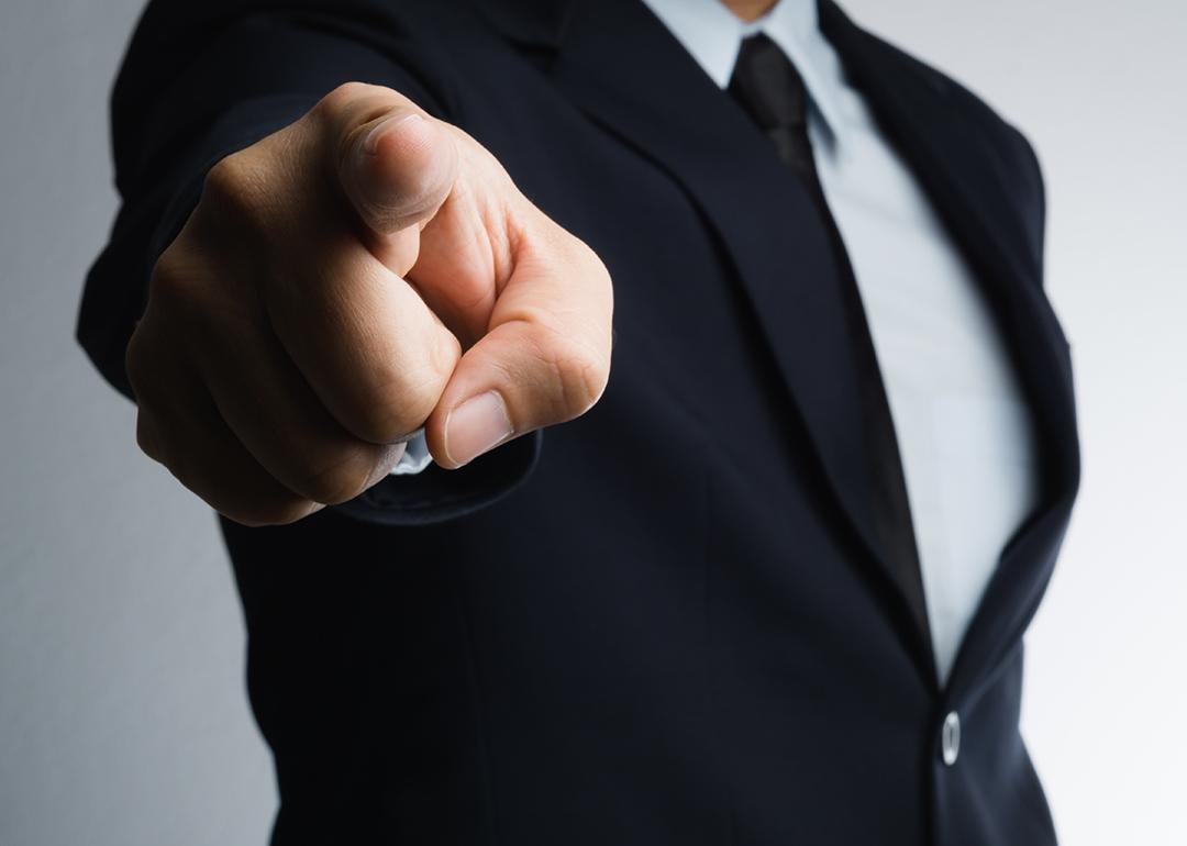 A businessman aggressively pointing a finger.