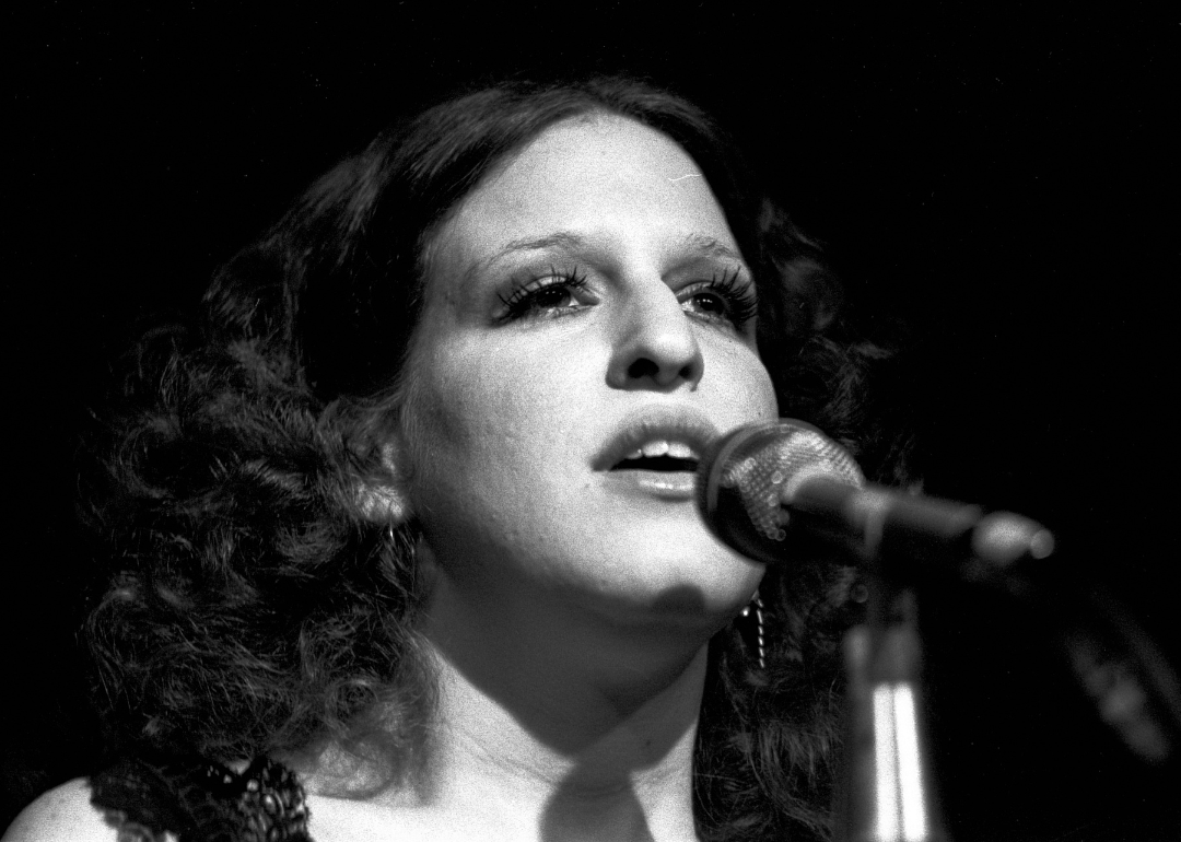 Close-up of American singer and actress Bette Midler as she performs onstage during her 'Continental Baths' tour, New York, New York, 1972. 