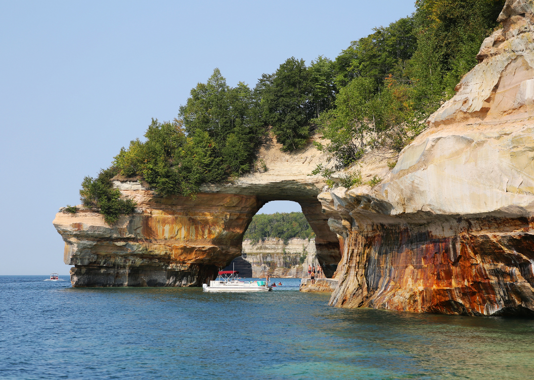 Tourists at Lovers Leap Arch, Pictured Rocks National Lakeshore of Lake Superior near Grand Marais, Michigan