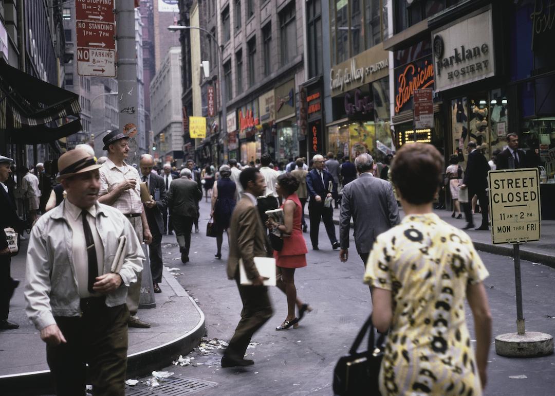 Pedestrians in Downtown Manhattan in New York City, New York, circa 1975.