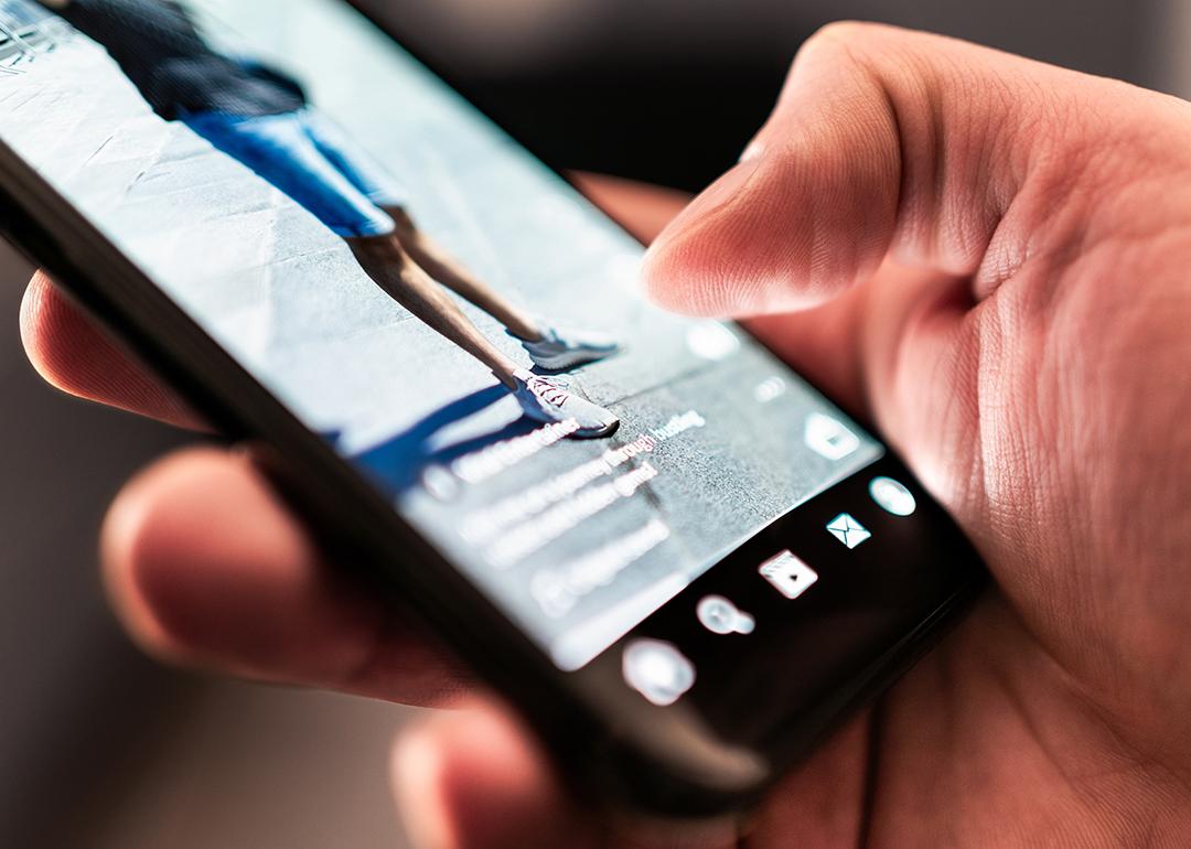 A focus on a user consuming reels and viral social media clips.
