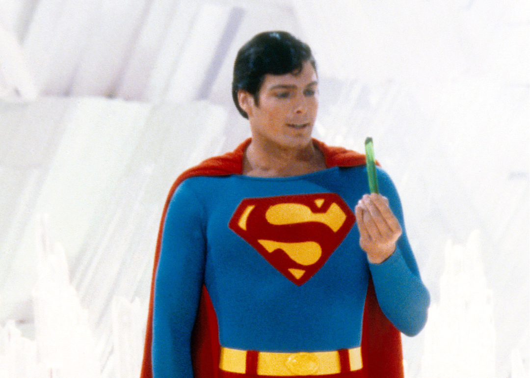 Superman, played by American actor Christopher Reeve (1952 - 2004), holds a green crystal at the Fortress of Solitude, in a promotional still from 'Superman', directed by Richard Donner, 1978.