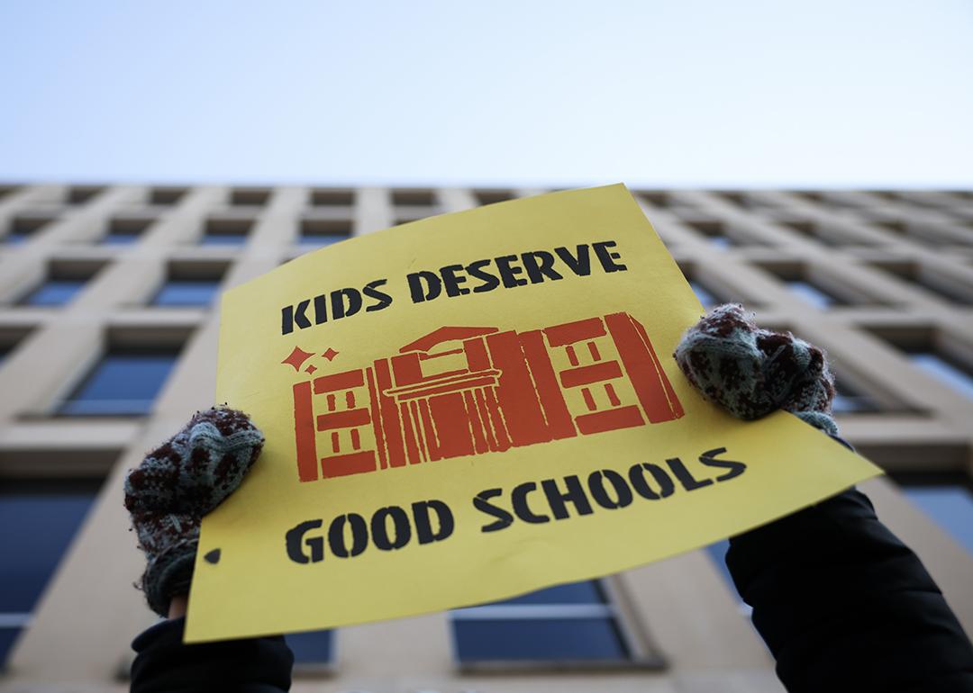 "Kids Deserve Good Schools" sign being held during a rally in front of the Department of Education on March 13, 2025 in Washington, D.C.