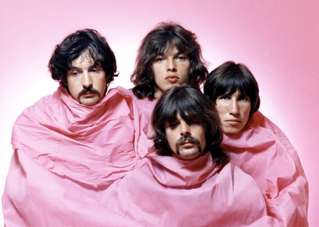 Pink Floyd pose for a portrait in Los Angeles in August 1968. (L–R) Nick Mason, Dave Gilmour, Rick Wright (center front), and Roger Waters.