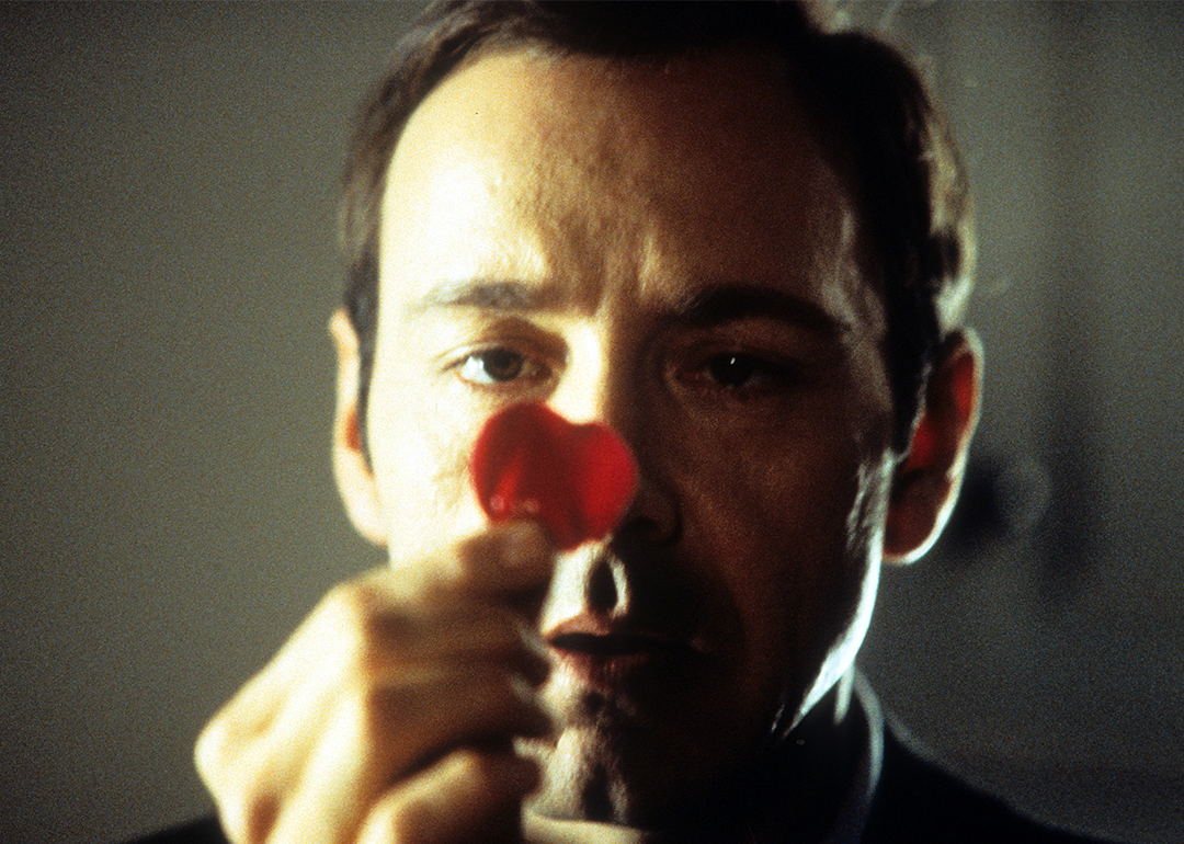 Kevin Spacey staring at a rose pedal in a scene from the film 'American Beauty’.