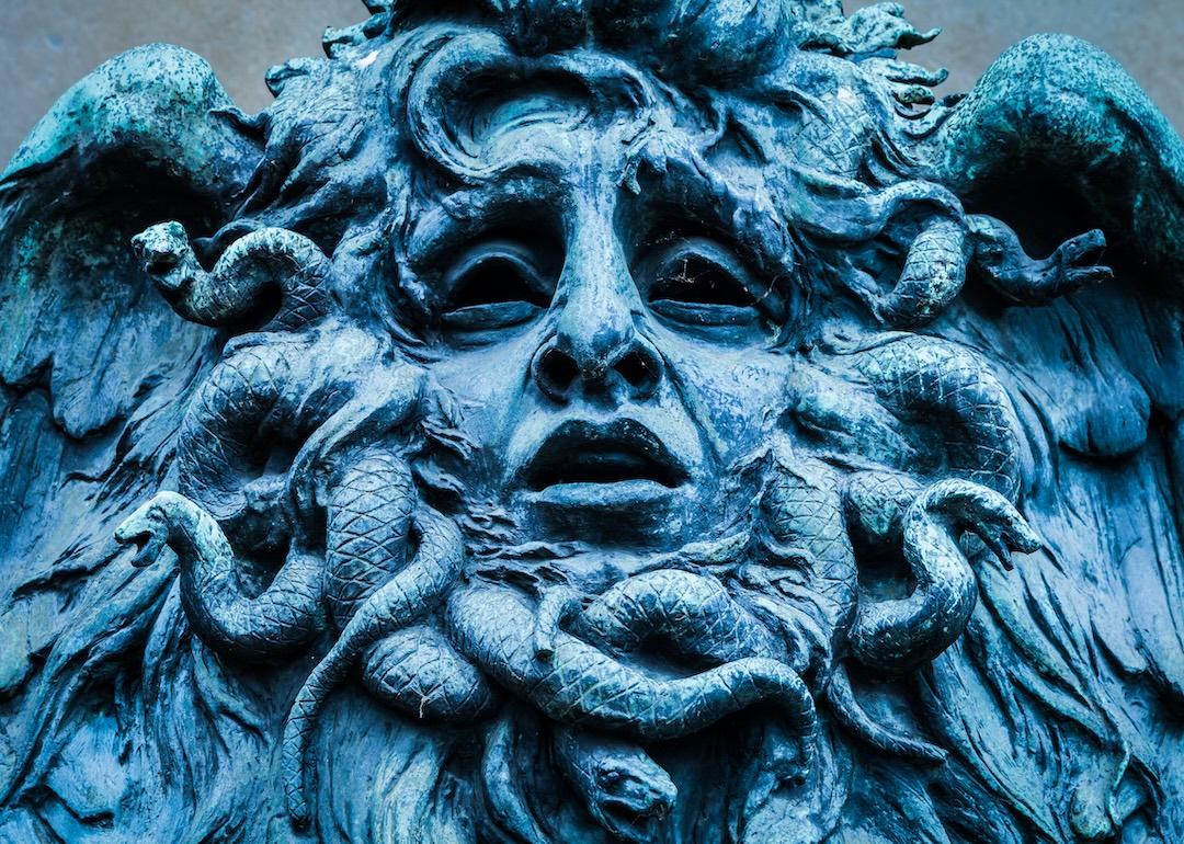 Medusa's head made of bronze close to the historical garden of Valentino in Turin.