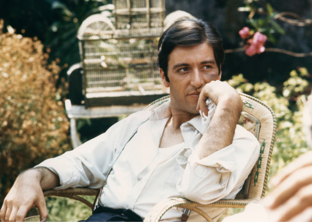 Al Pacino seated in garden as Michael Corleone from the 1972 movie 'The Godfather'