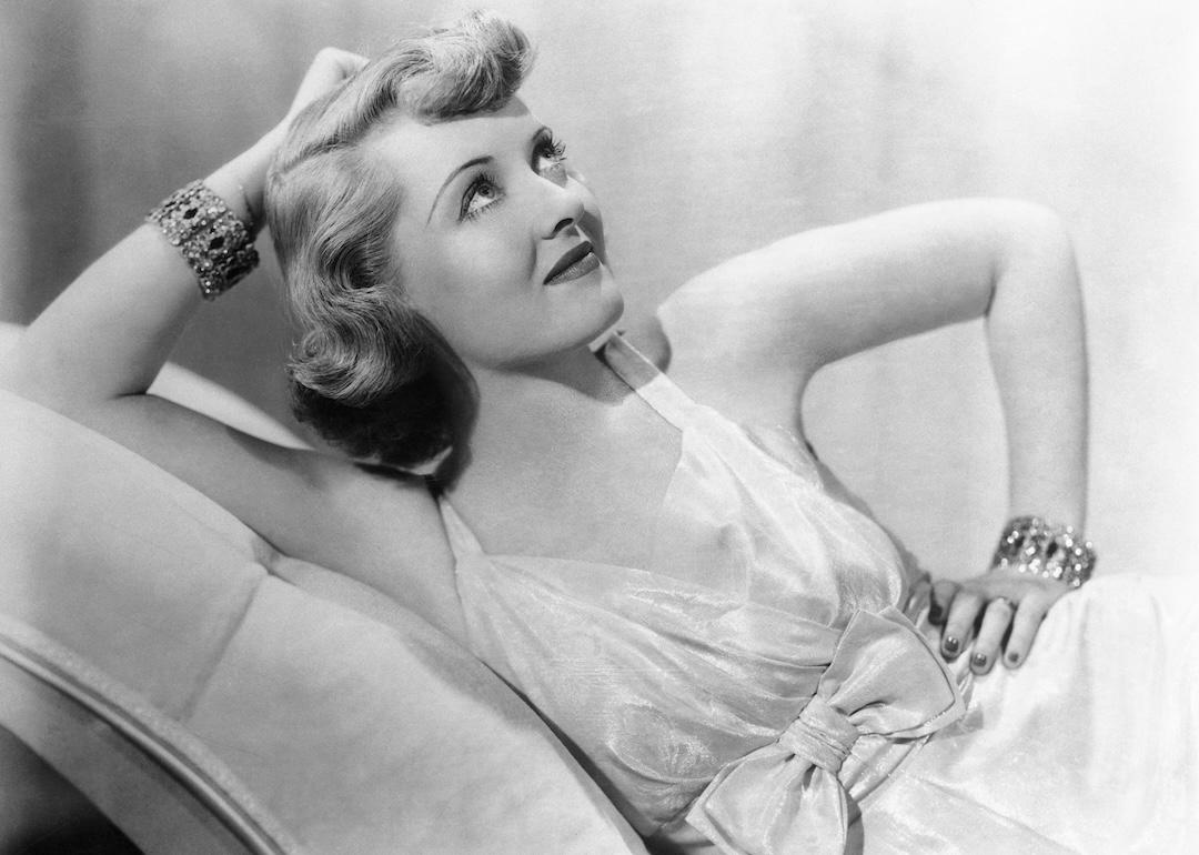 Portrait of Bette Davis lounging.