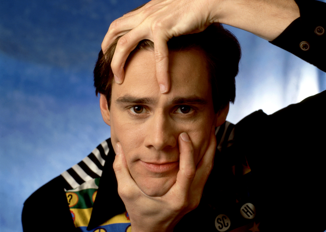 Actor and comedian Jim Carrey poses for a portrait grabbing his head and chin in Los Angeles, California, October 24, 1994. 