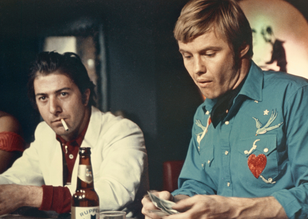 Jon Voight and Dustin Hoffman bat bar in scene from the 1969 film 'Midnight Cowboy'.