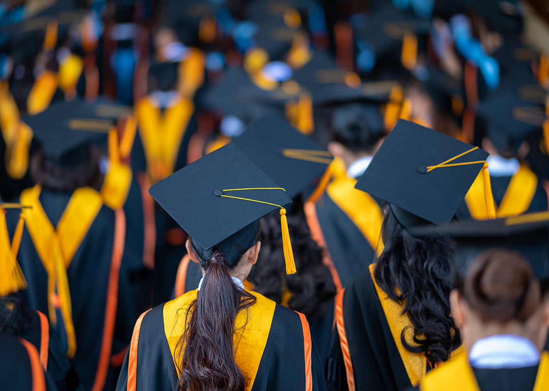 Graduates in caps and gown at commencement.