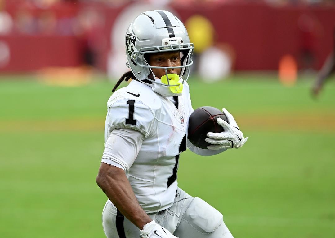 Tre Tucker of the Las Vegas Raiders scores a fourth-quarter touchdown against the Washington Commanders at Northwest Stadium in Landover, Maryland, on September 21, 2025.