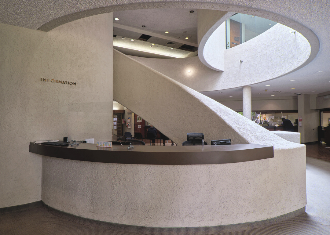 An interior view of a spiral staircase inside Carson City Hall in California.
