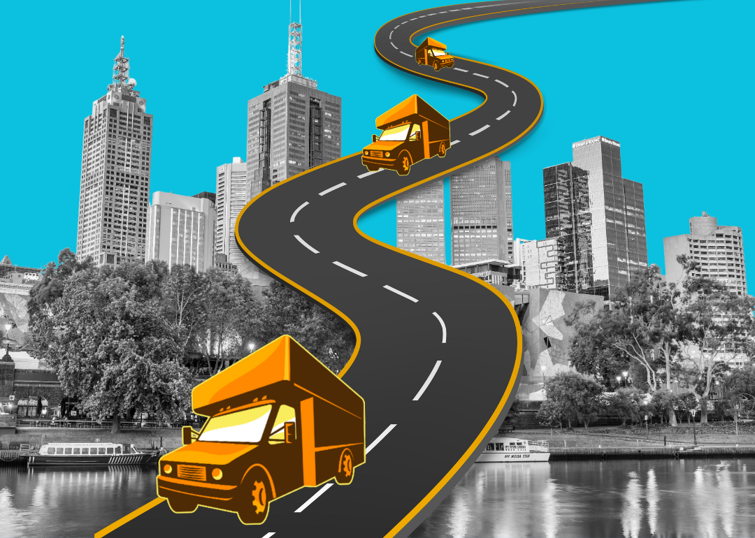 Illustration of illustrated moving vans driving along a highway with a cityscape in the background.