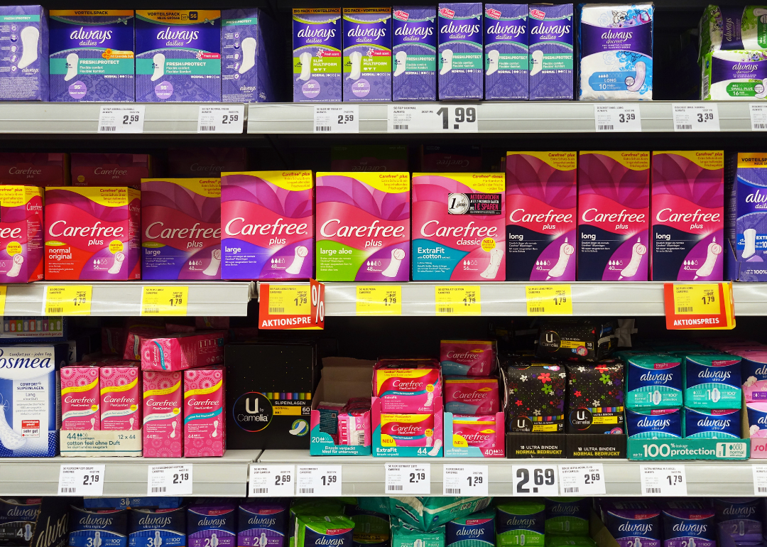 A store shelf displaying feminine products that are subject to the pink tax